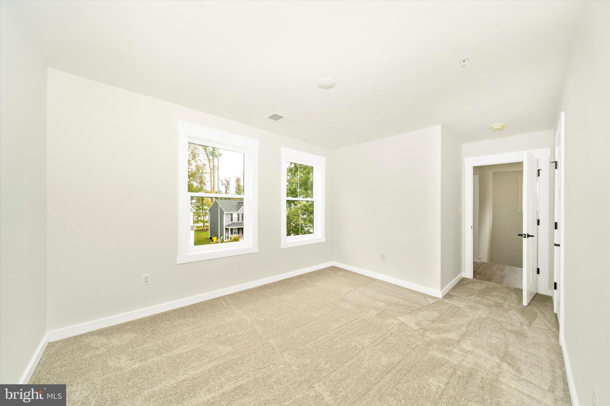 203 Riverside Drive Chester, MD 21619 - Photo 47 of 68 an empty room with a empty space and windows