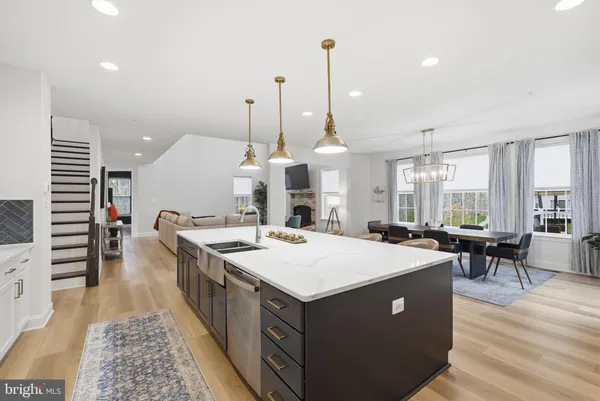 a large kitchen with a table and chairs