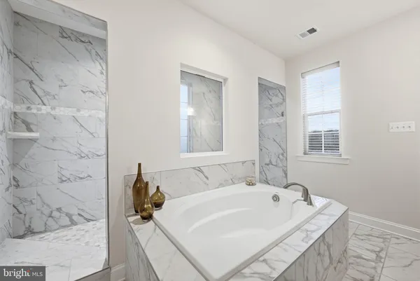 a bathroom with a double vanity sink mirror and double