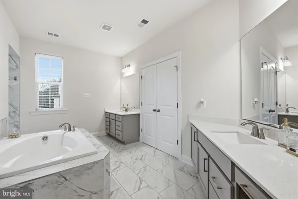 a picture of a rug with a white wall and white picture