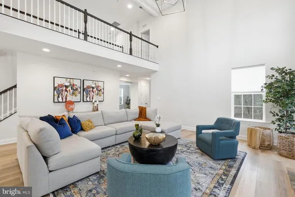 a living room with furniture or couch and a dining table
