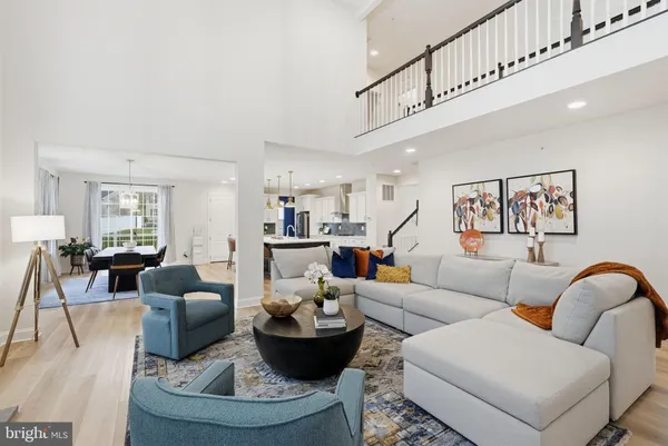 a living room with furniture fireplace and flat screen tv