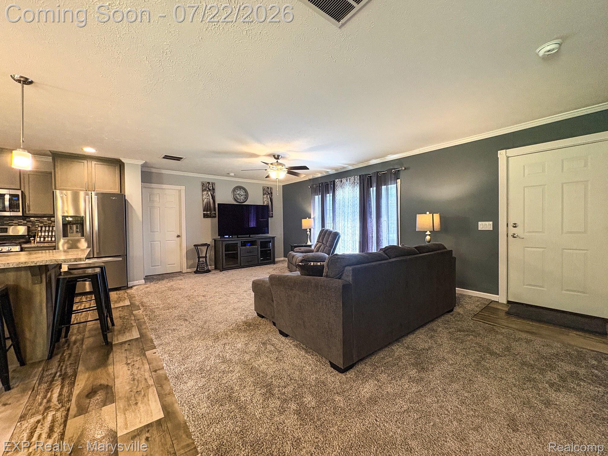 2601 Beach Road Port Huron, MI 48060 - Photo 7 of 34 Open concept living space featuring a combination of wood-finish flooring and carpet