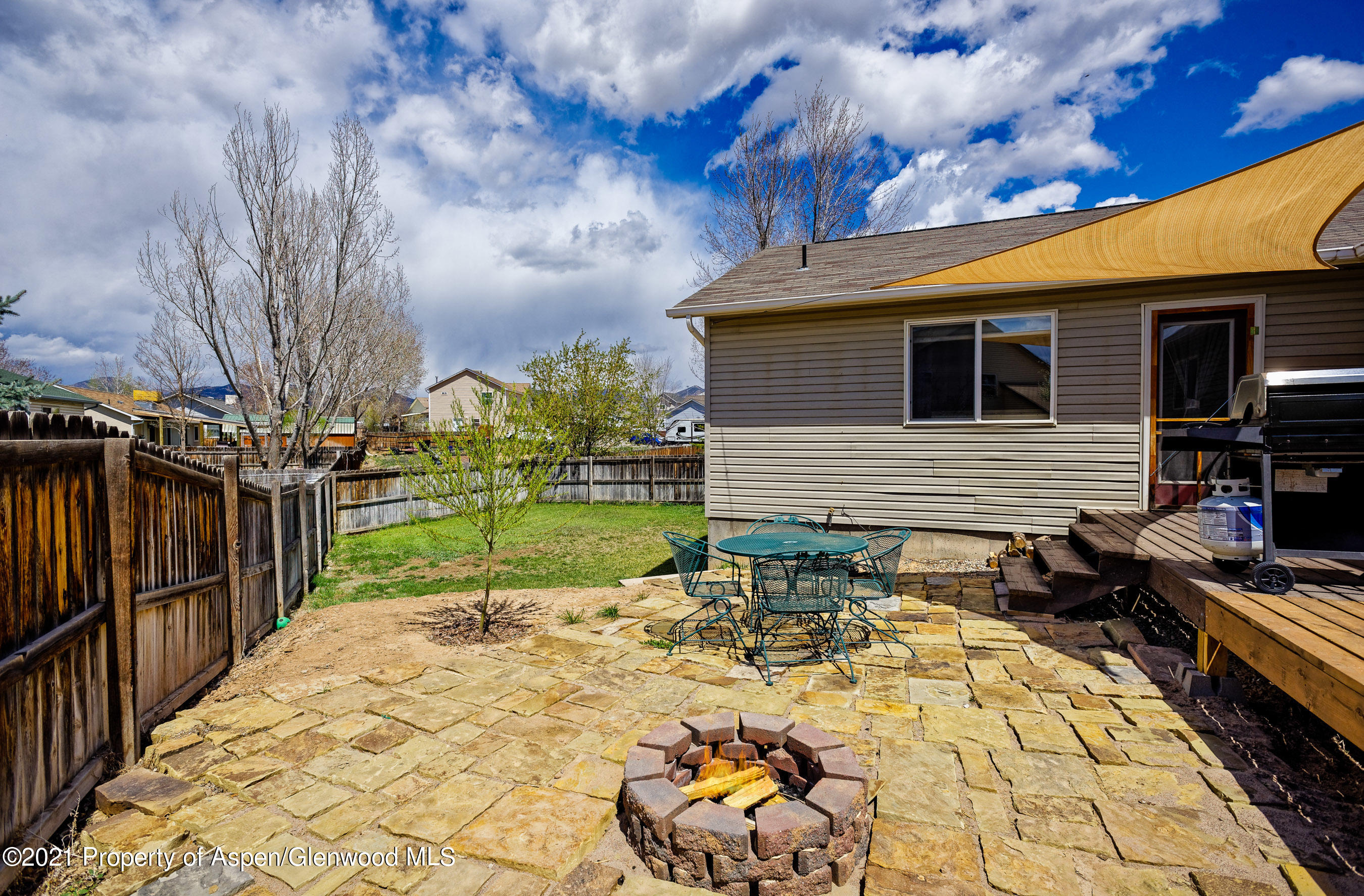 1503 Beech Street Rifle, CO 81650 - Photo 5 of 8 a view of a backyard with sitting area