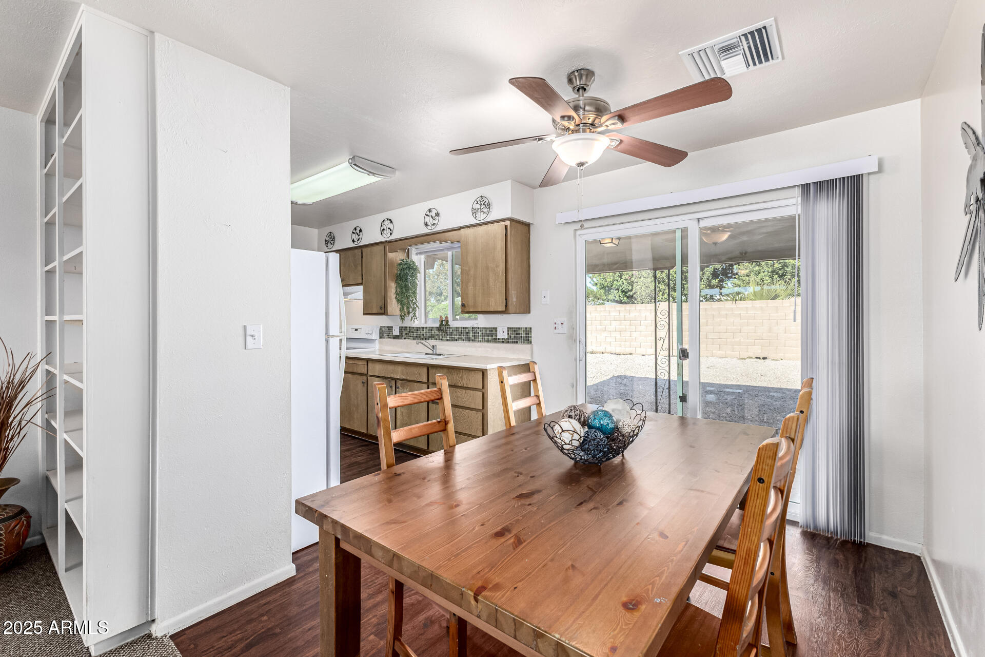 6256 East Decatur Street Mesa, AZ 85205 - Photo 12 of 28 a view of a dining room with furniture window and wooden floor