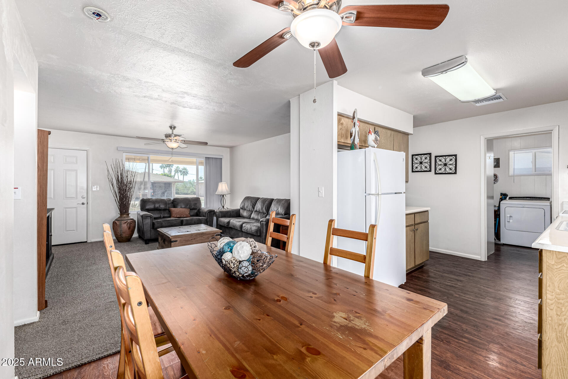6256 East Decatur Street Mesa, AZ 85205 - Photo 13 of 28 a living room with furniture dining table and wooden floor