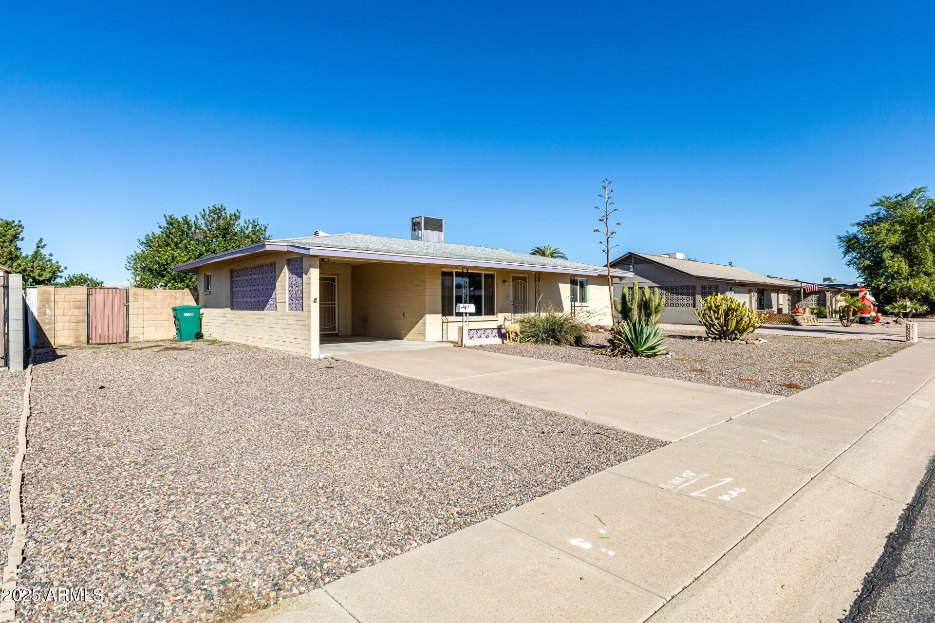 6256 East Decatur Street Mesa, AZ 85205 - Photo 7 of 28 a front view of a house with a yard