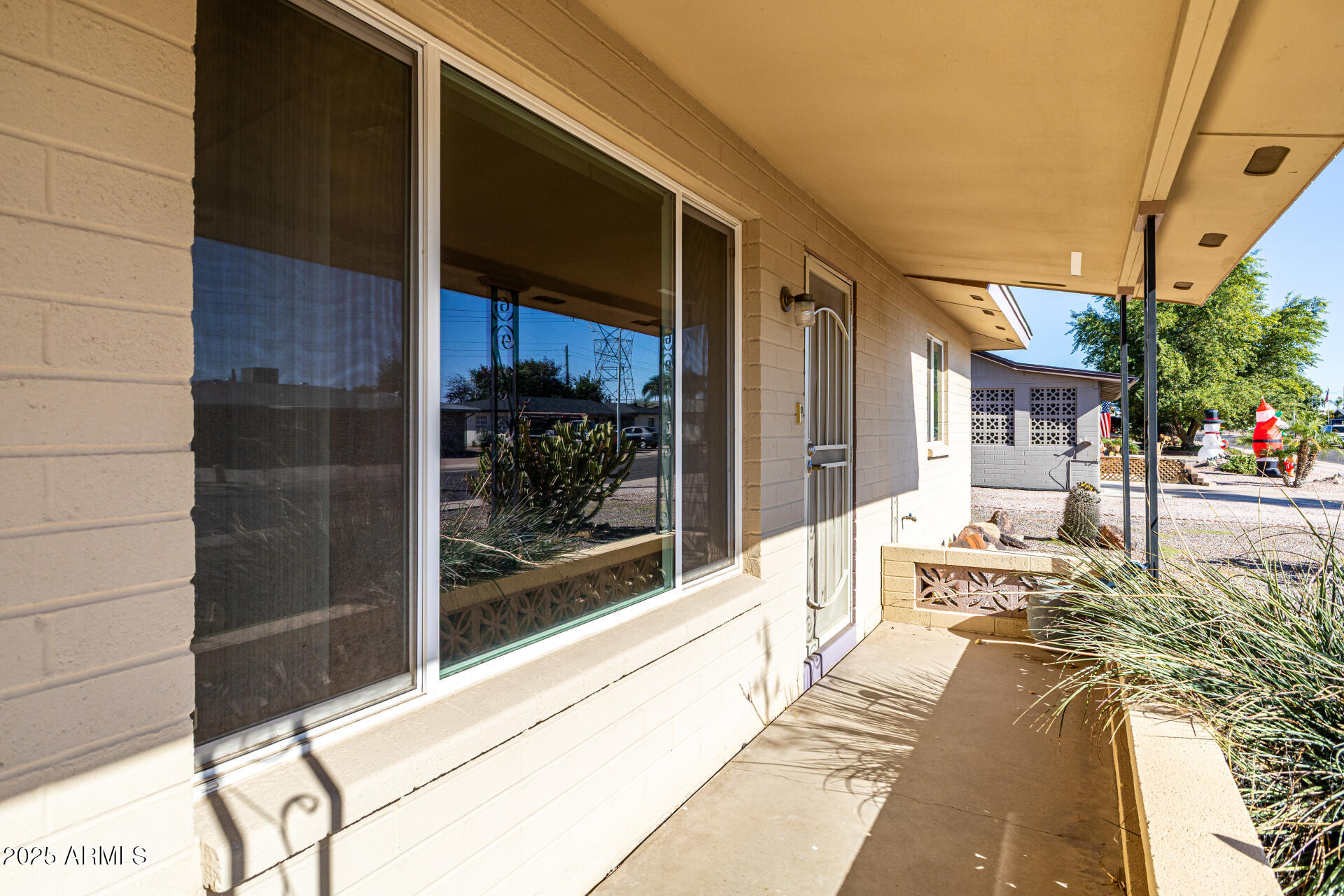 6256 East Decatur Street Mesa, AZ 85205 - Photo 10 of 28 a building exterior with furniture