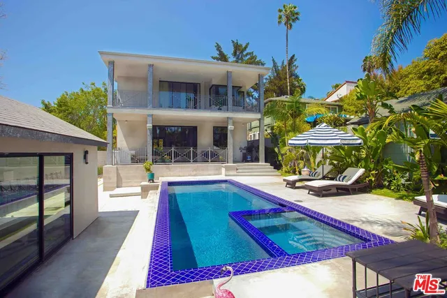 a view of a house with swimming pool