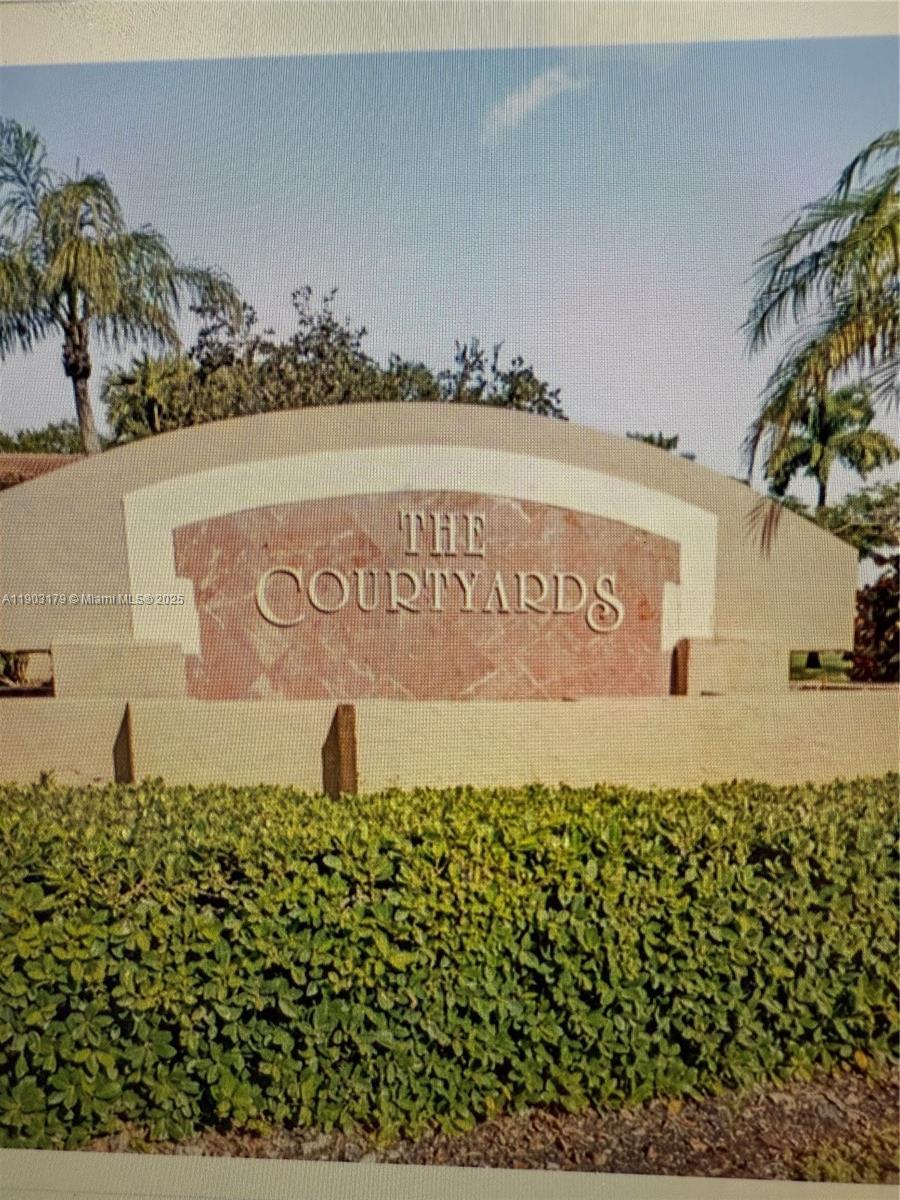 15827 Southwest 12th Street, Unit 15827 Pembroke Pines, FL 33027 - Photo 5 of 6 a sign on the wall