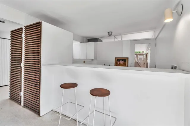 a kitchen with kitchen island cabinets and window