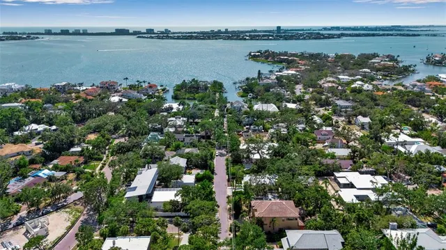 an aerial view of a city with lake view