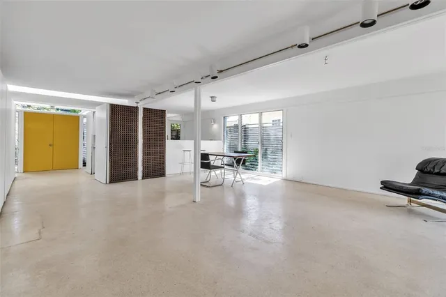 a view of a livingroom with furniture and a ceiling fan