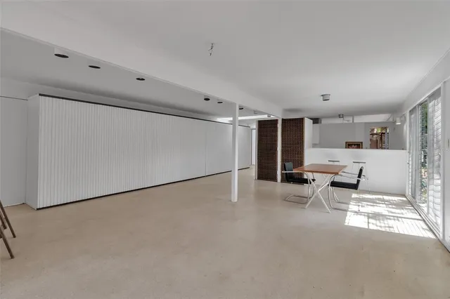 a lobby with furniture and window