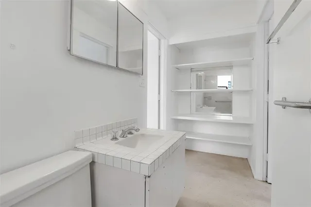 a bathroom with a sink and a vanity