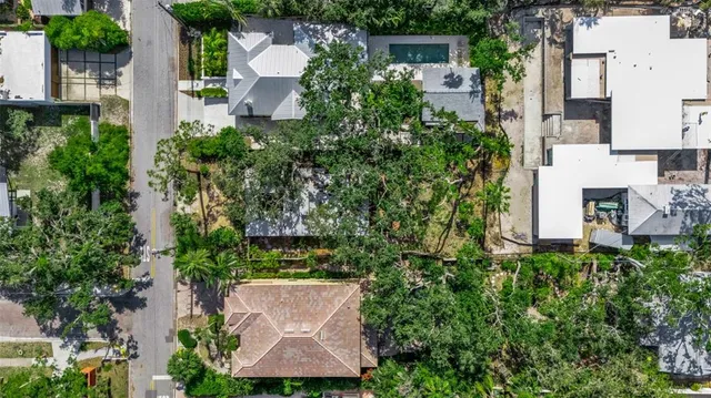 an aerial view of a house with a yard and garden