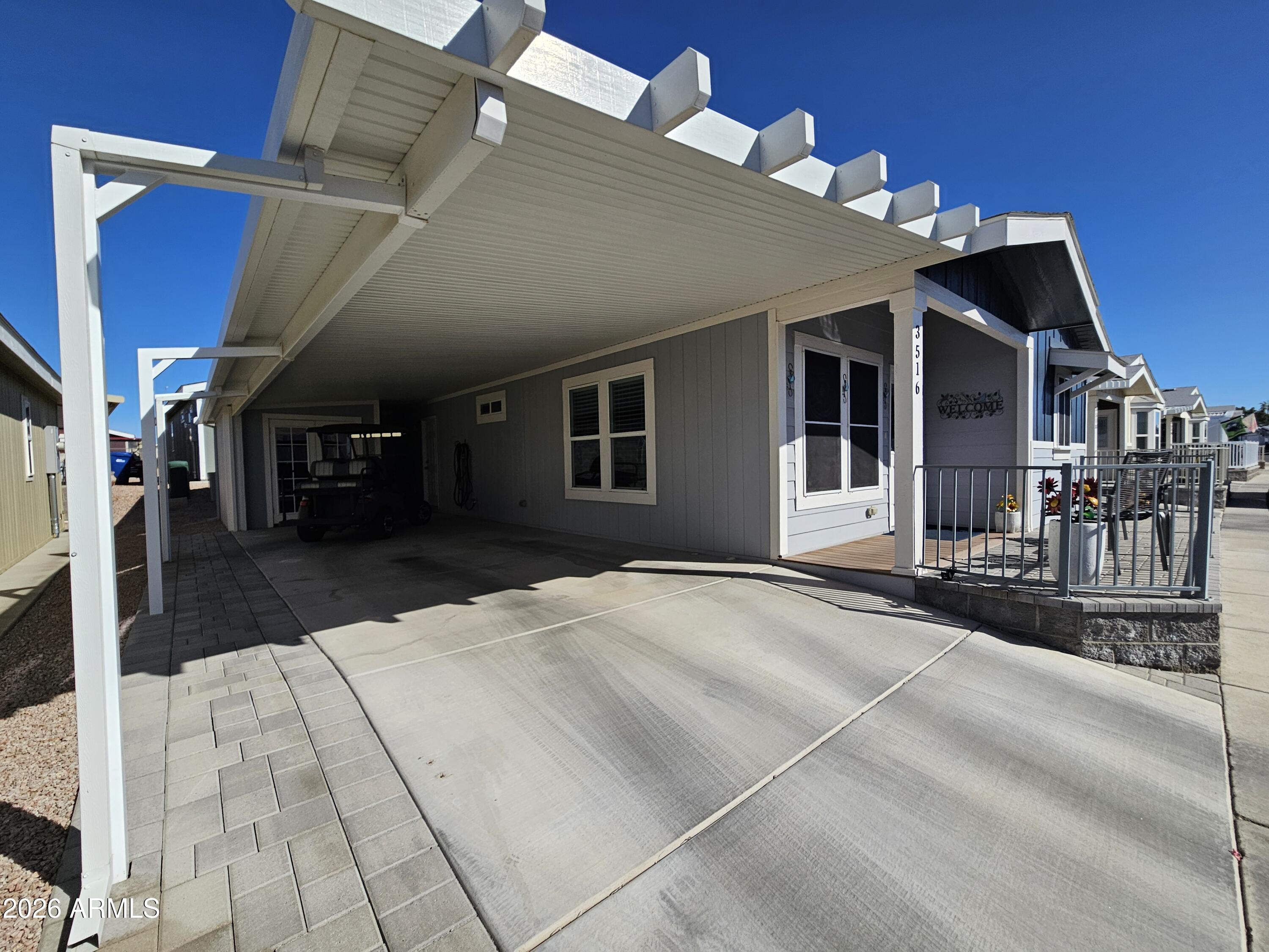 650 North Hawes Road, Unit 3516 Mesa, AZ 85207 - Photo 11 of 37 a view of a house with a barbeque