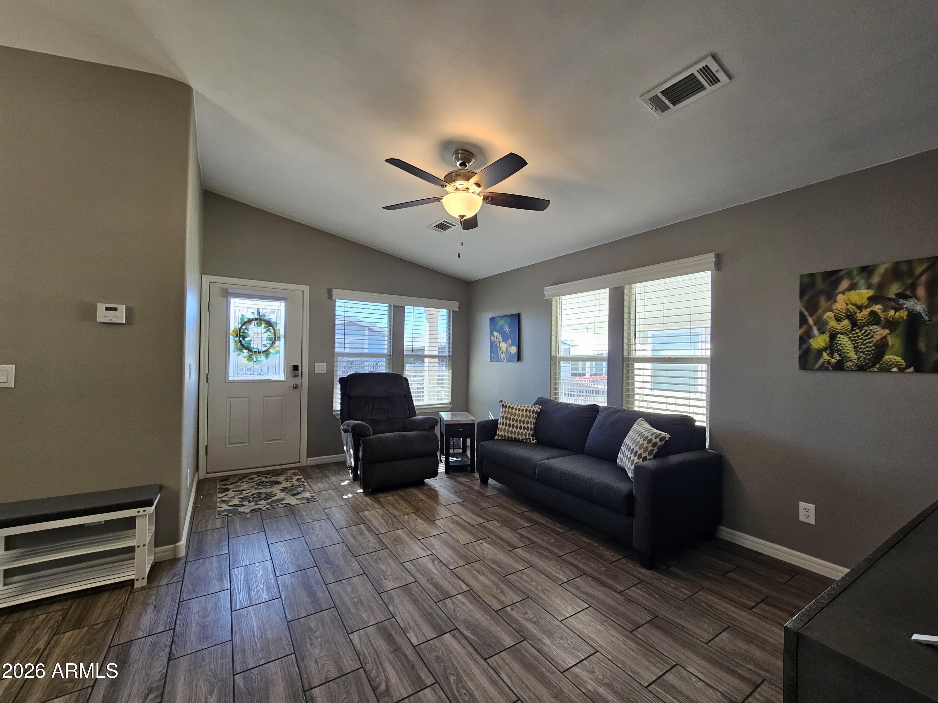 650 North Hawes Road, Unit 3516 Mesa, AZ 85207 - Photo 15 of 37 a living room with furniture and wooden floor