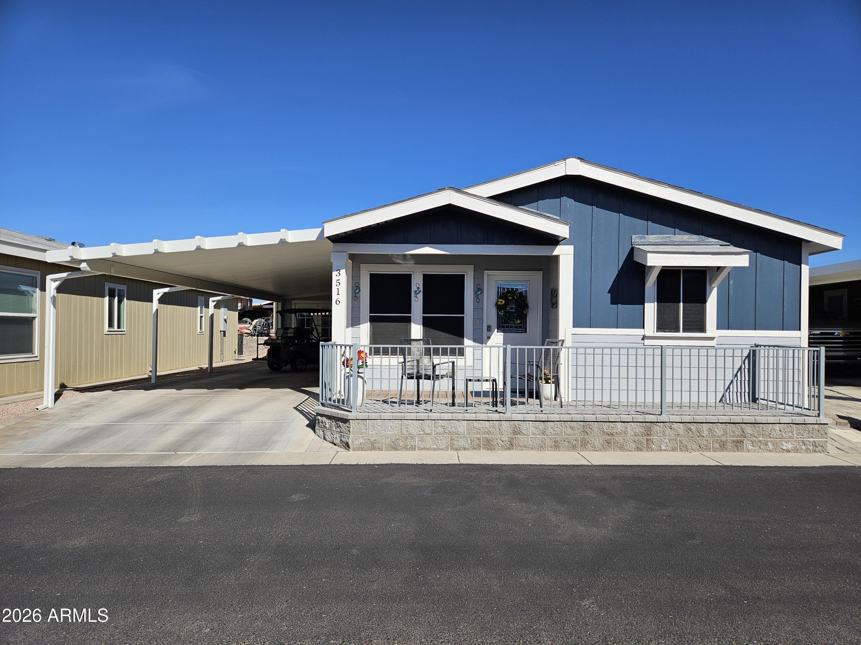 650 North Hawes Road, Unit 3516 Mesa, AZ 85207 - Photo 6 of 37 a front view of a house with a porch