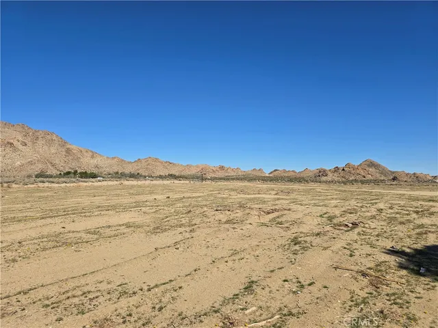 a view of a lake with mountains in the background