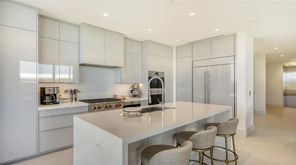 a very nice looking living room with a large window and a table
