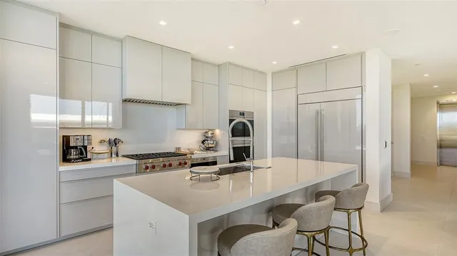 a very nice looking living room with a large window and a table