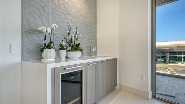 a kitchen with stainless steel appliances kitchen island granite countertop a stove and a refrigerator