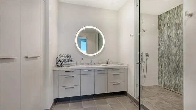 a bedroom with a bed and a night stand