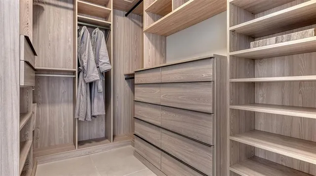 a bathroom with a bathtub and a mirror