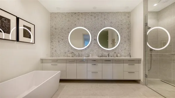 a utility room with sink dryer and washer