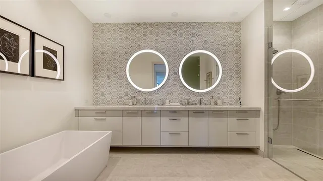a utility room with sink dryer and washer