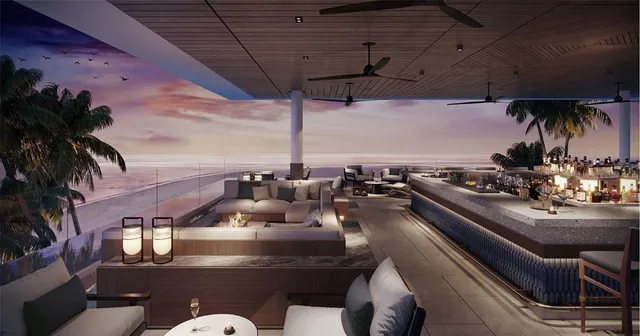 a living room with furniture and a dining table