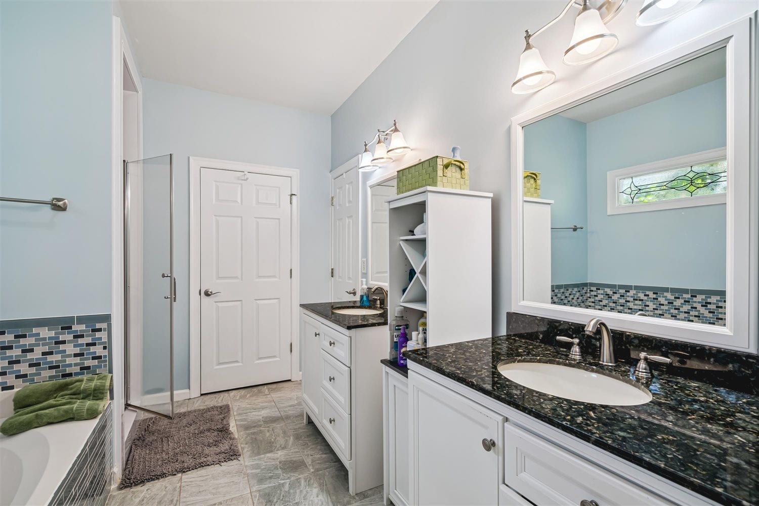 1489 John Ridge Drive Collierville, TN 38017 - Photo 23 of 39 a bathroom with a granite countertop double vanity sink mirror and