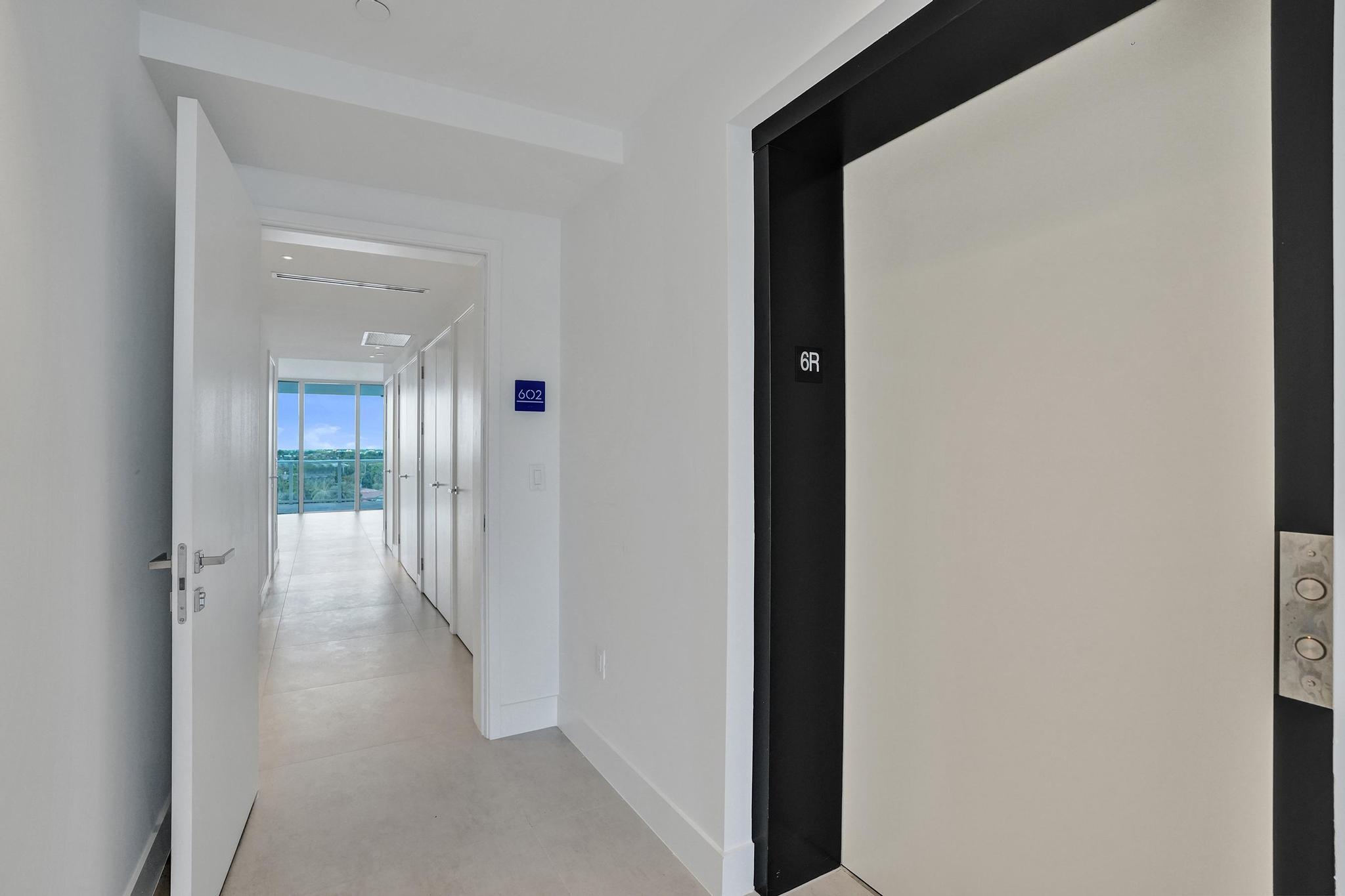 407 North Riverside Drive, Unit 602 Pompano Beach, FL 33062 - Photo 39 of 83 a view of a hallway with wooden floor