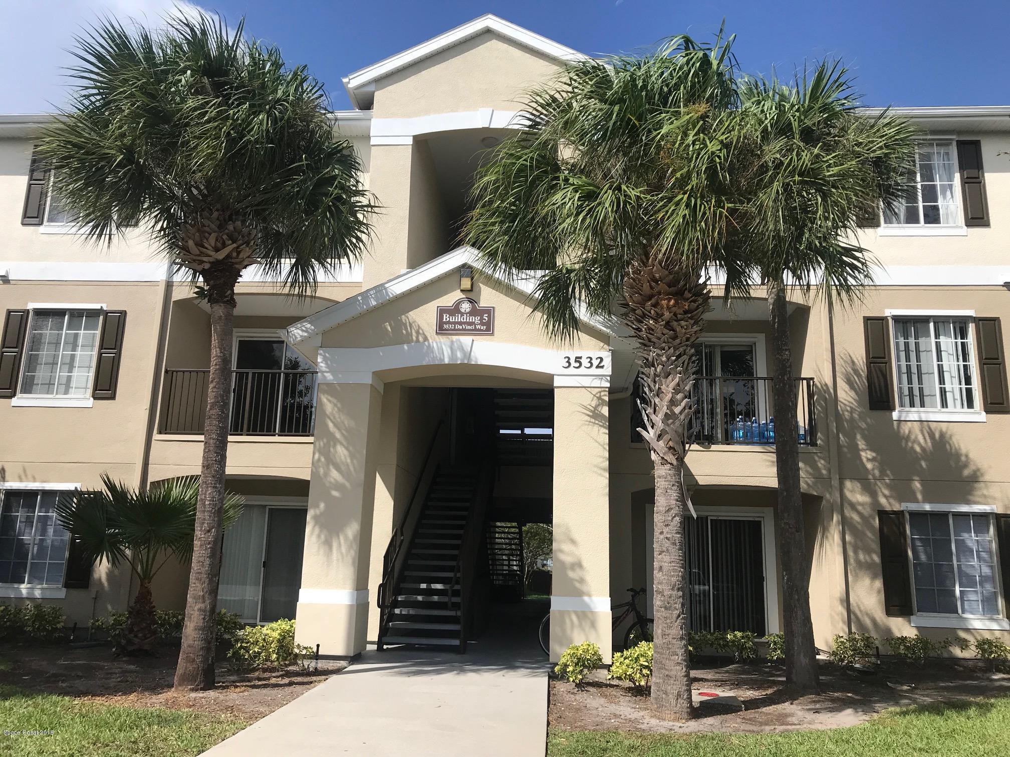 3532 D'Avinci Way, Unit 3015 Melbourne, FL 32901 - Photo 1 of 20 a front view of a house with a tree