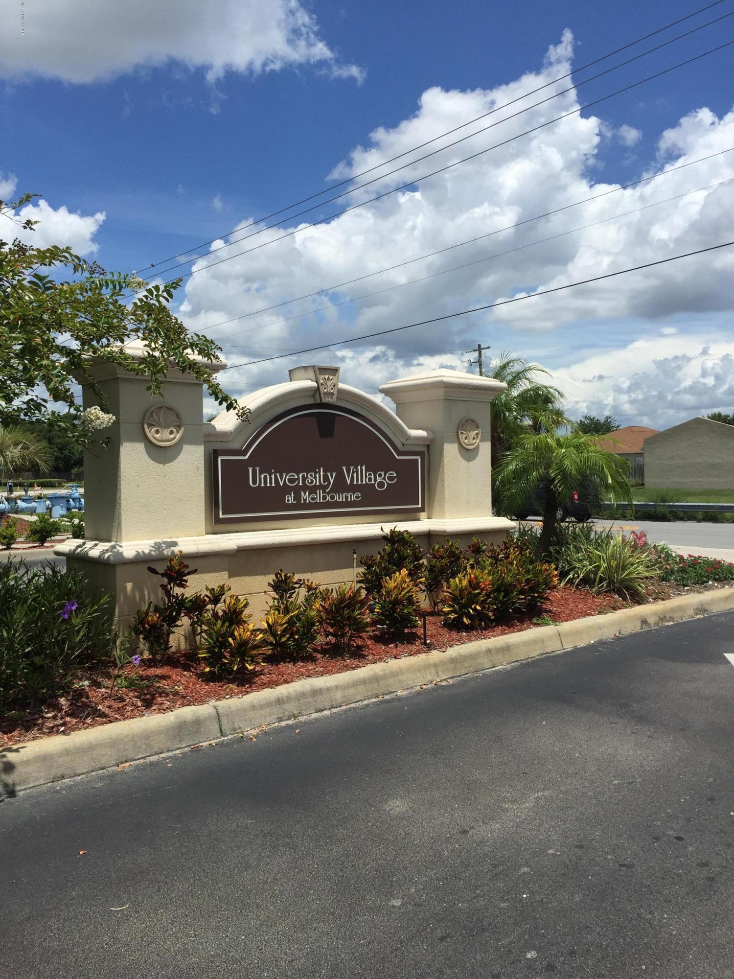 3532 D'Avinci Way, Unit 3015 Melbourne, FL 32901 - Photo 13 of 20 a front view of a house with a yard