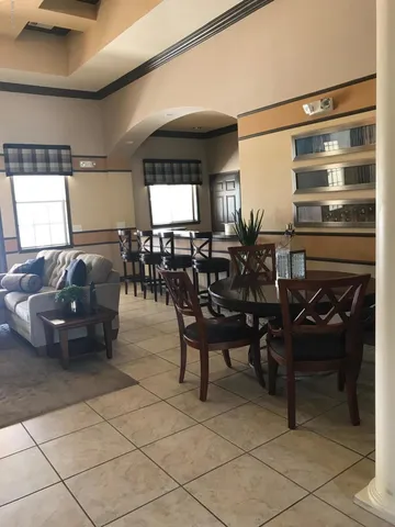 a view of a livingroom with furniture and window