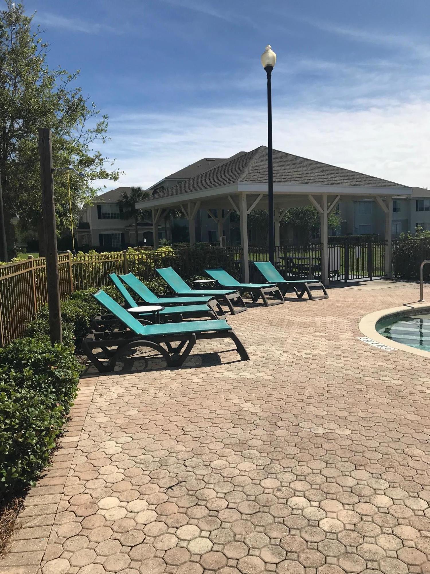 3532 D'Avinci Way, Unit 3015 Melbourne, FL 32901 - Photo 19 of 20 a house view with a backyard space