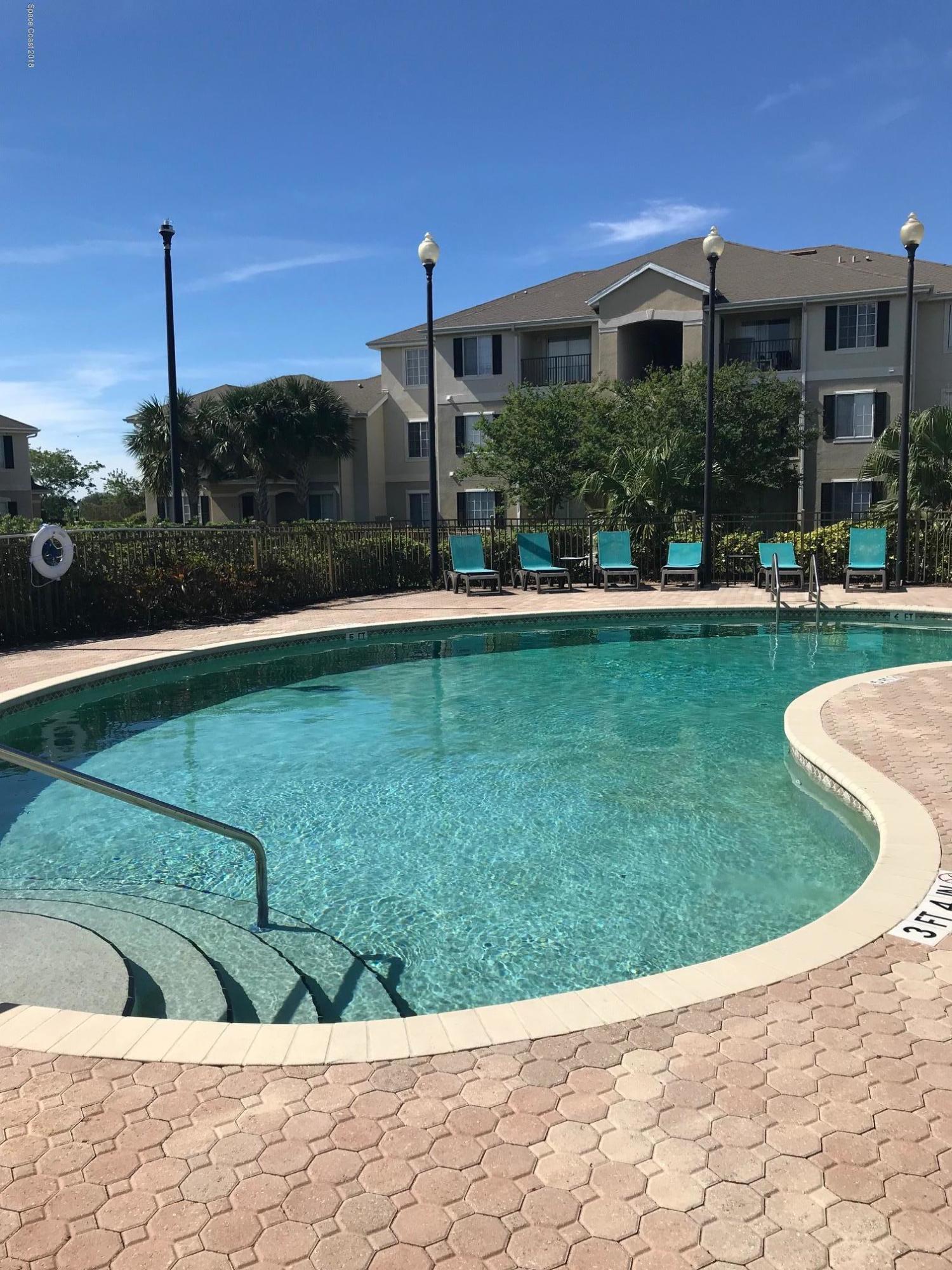 3532 D'Avinci Way, Unit 3015 Melbourne, FL 32901 - Photo 20 of 20 a view of a house with garden and a sitting area