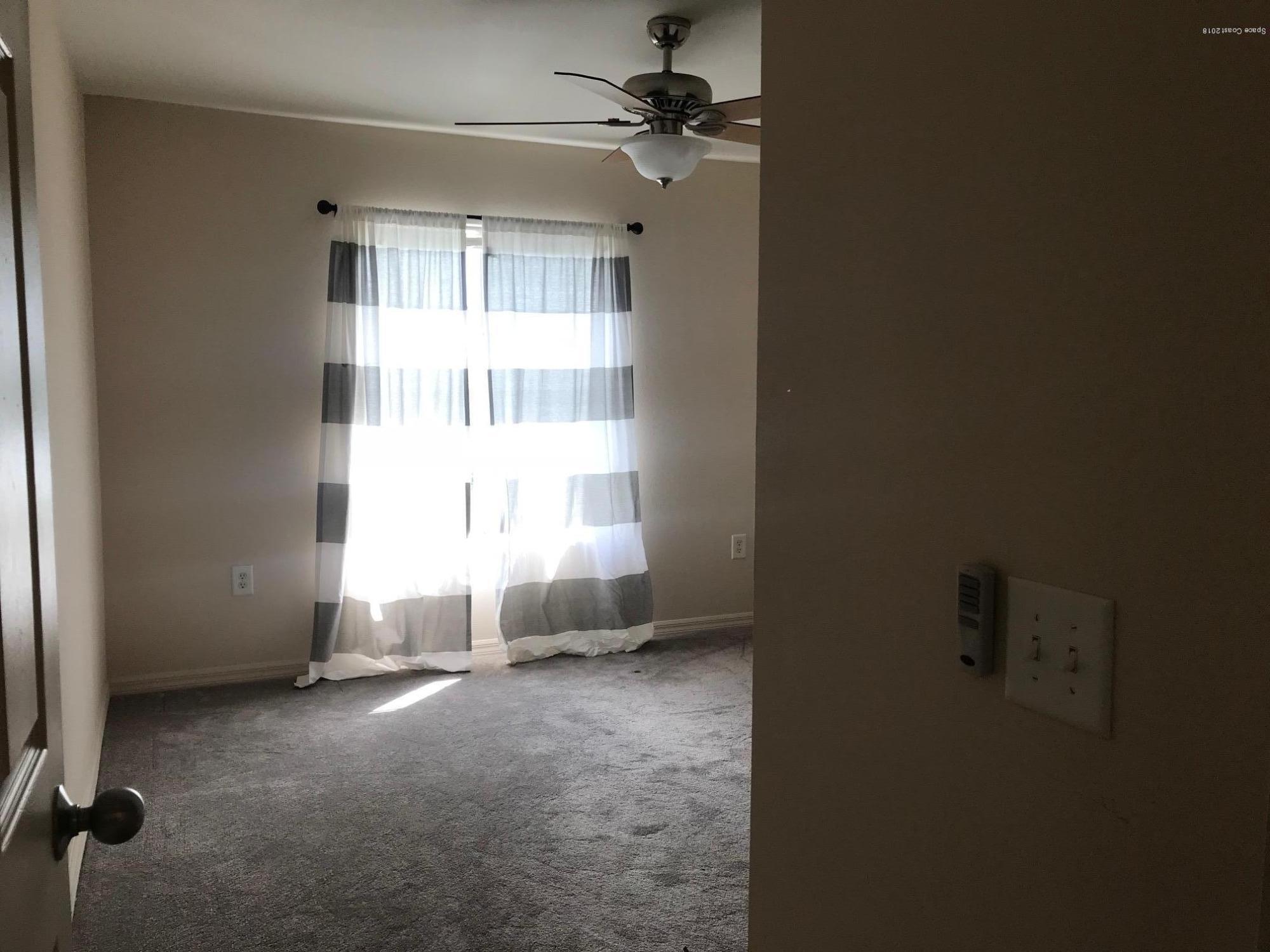 3532 D'Avinci Way, Unit 3015 Melbourne, FL 32901 - Photo 9 of 20 an empty room with windows