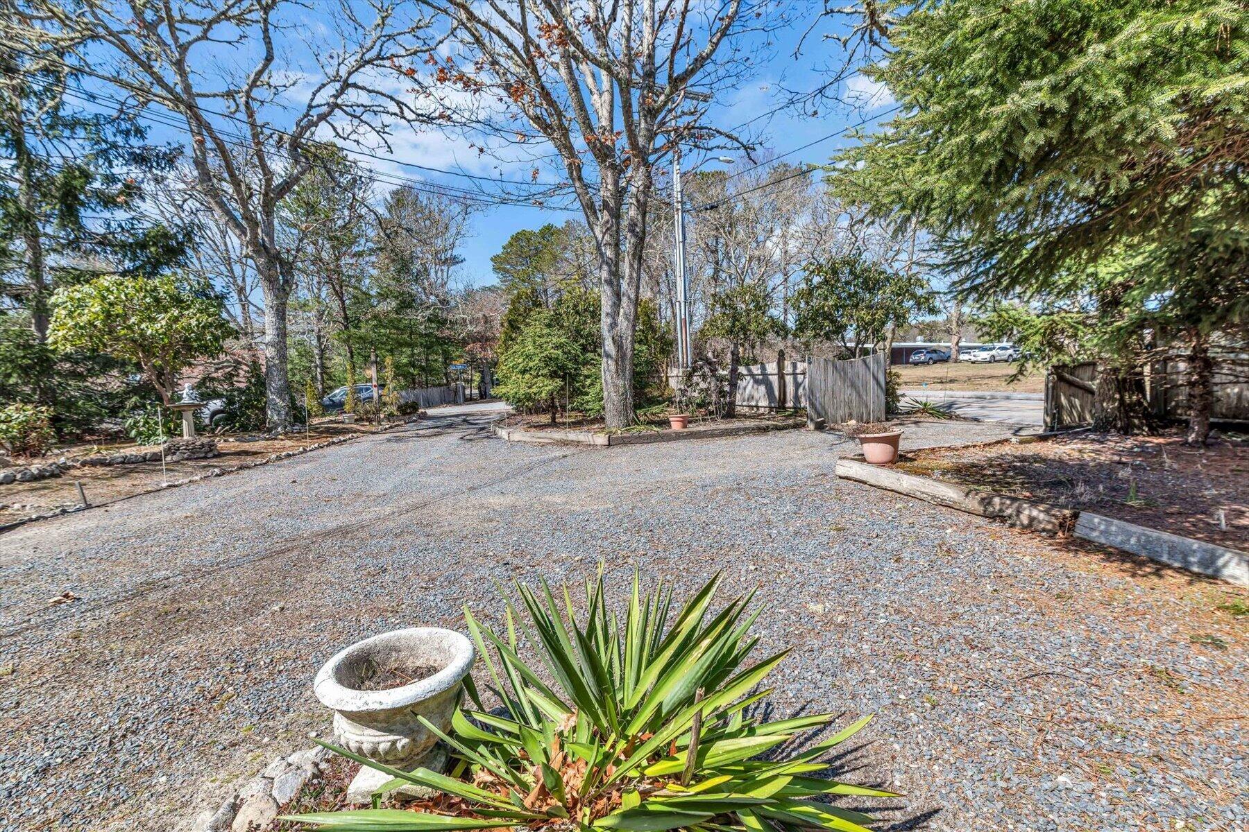 5 Briar Patch Road Osterville, MA 02655 - Photo 27 of 29 a view of a backyard with plants and trees