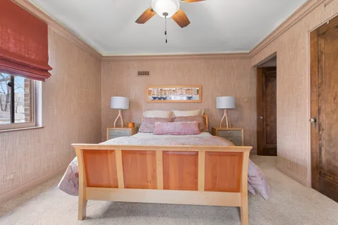 a bedroom with a bed and window