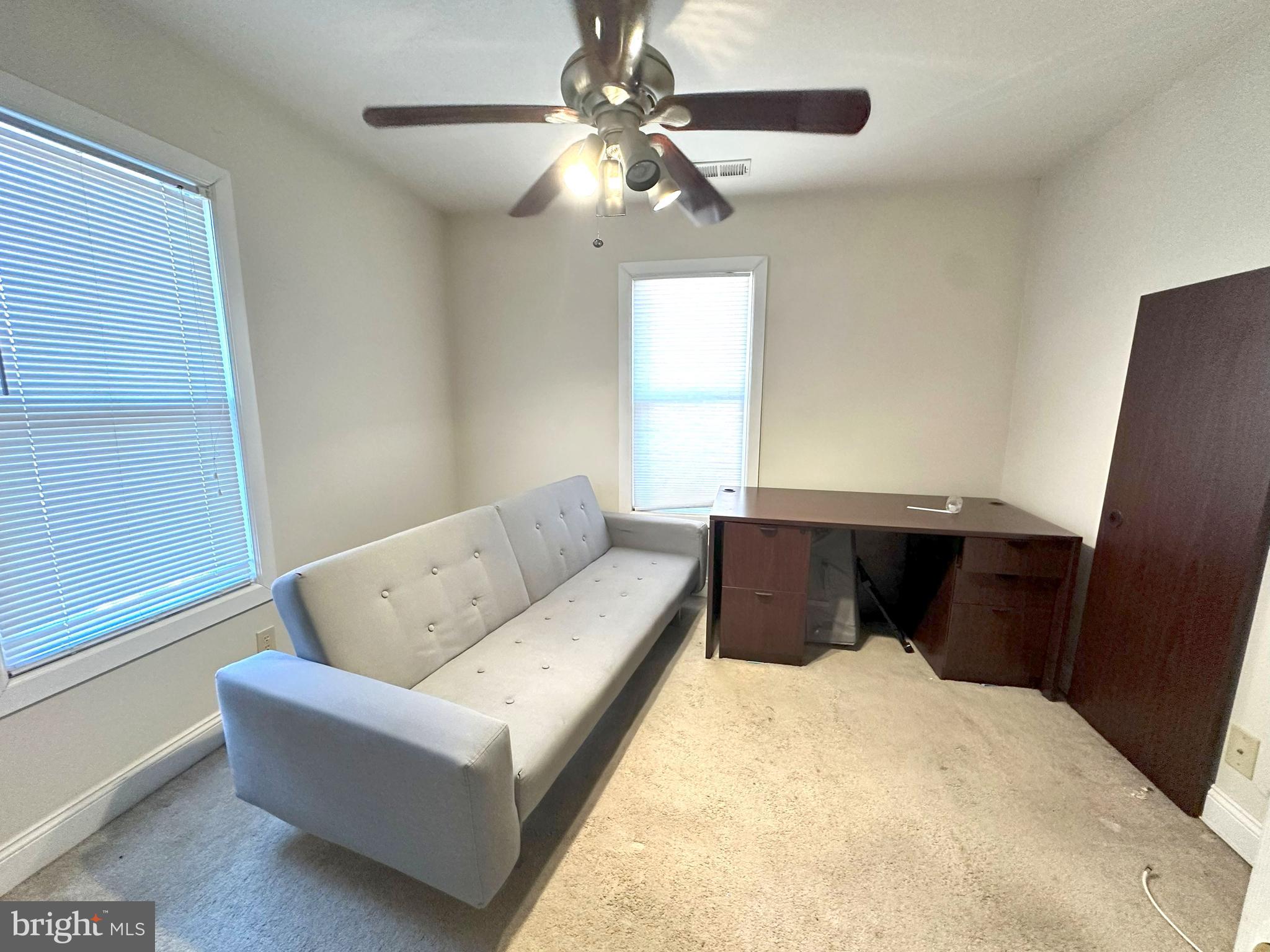 307 Grant Avenue Pitman, NJ 08071 - Photo 11 of 19 a bedroom with a large bed and a ceiling fan