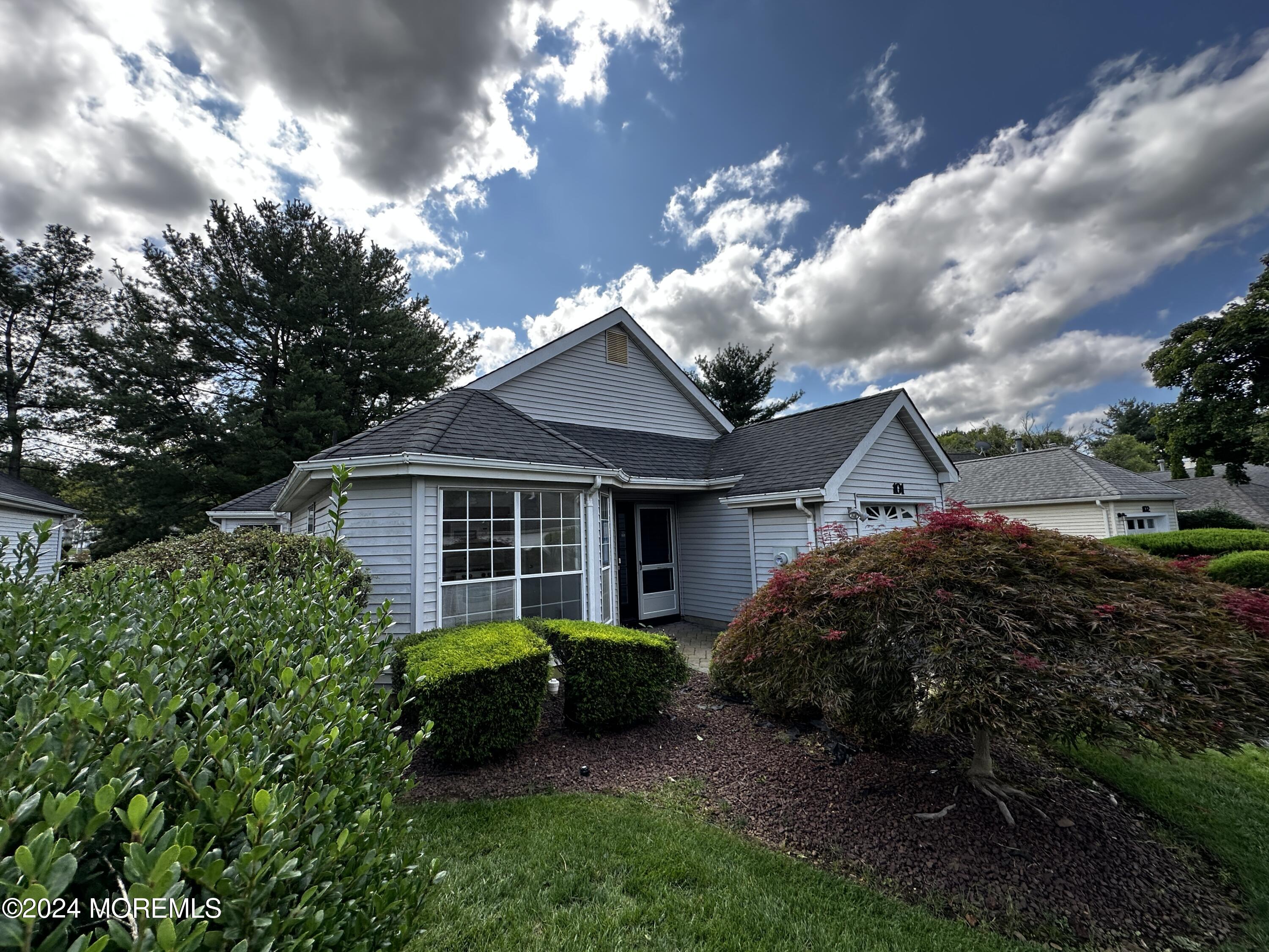 101 Almond Road Freehold, NJ 07728 - Photo 2 of 12 a view of a house with a garden