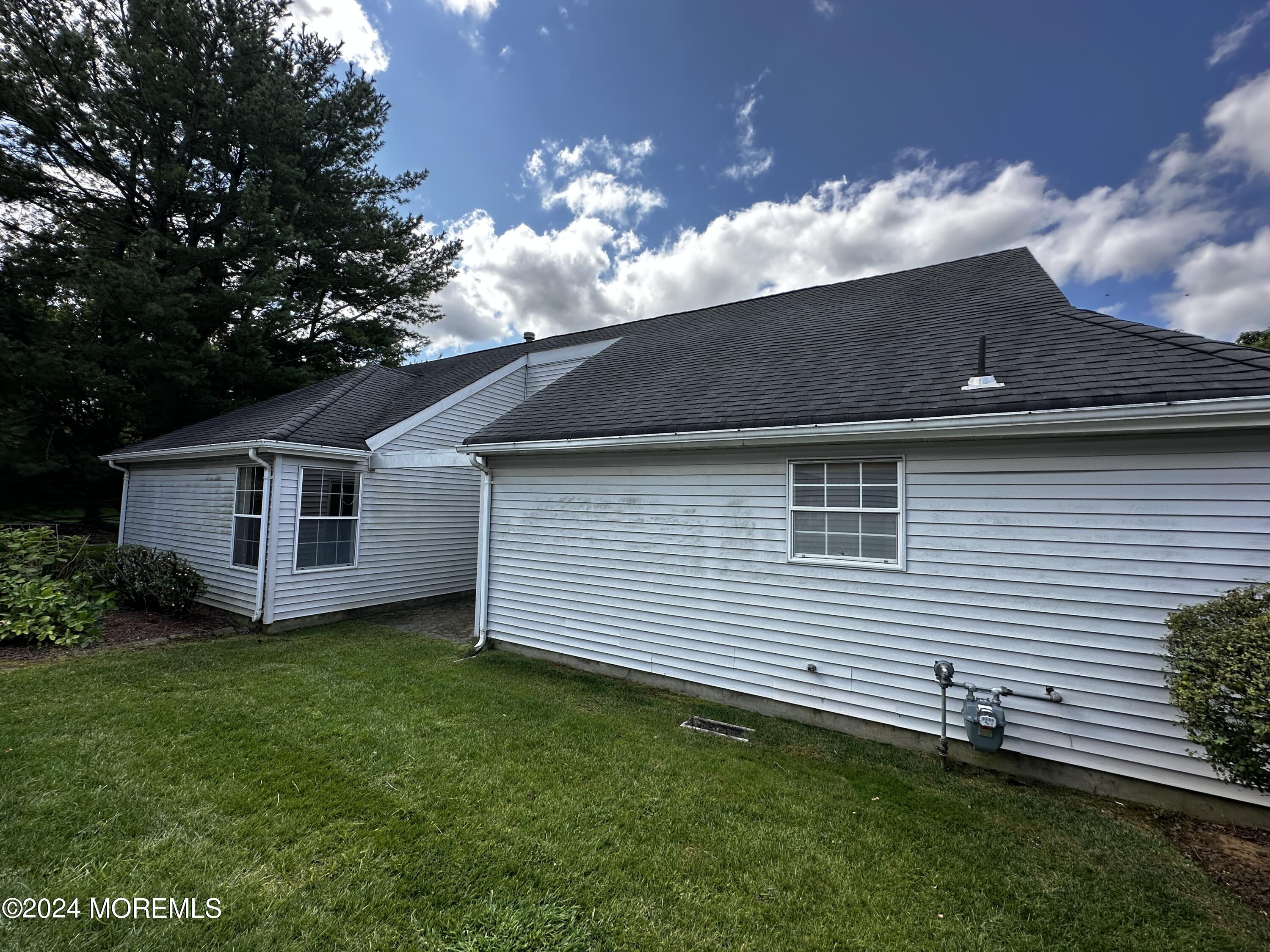 101 Almond Road Freehold, NJ 07728 - Photo 3 of 12 a view of a house with a yard