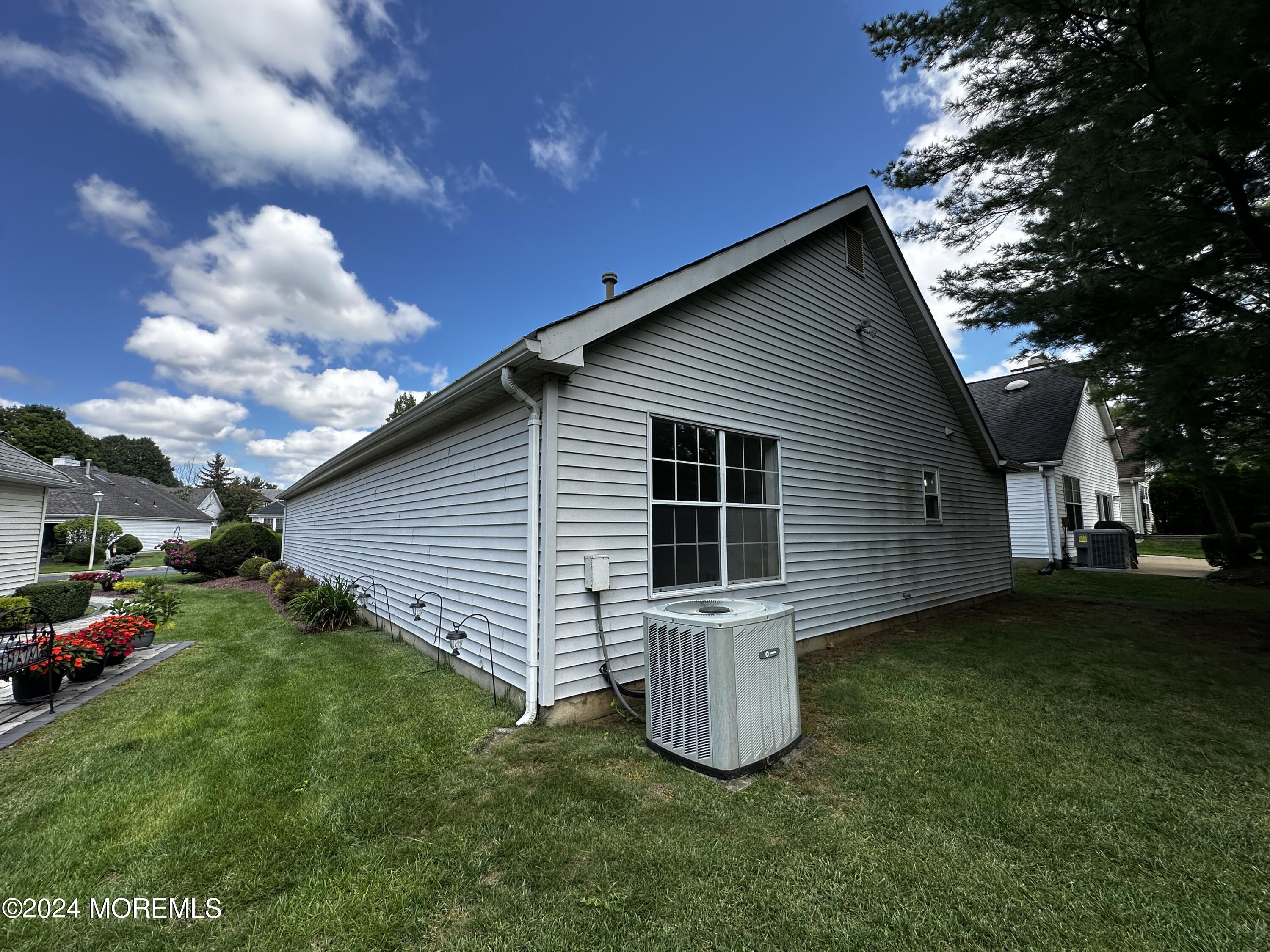 101 Almond Road Freehold, NJ 07728 - Photo 4 of 12 a view of a house with backyard and garden