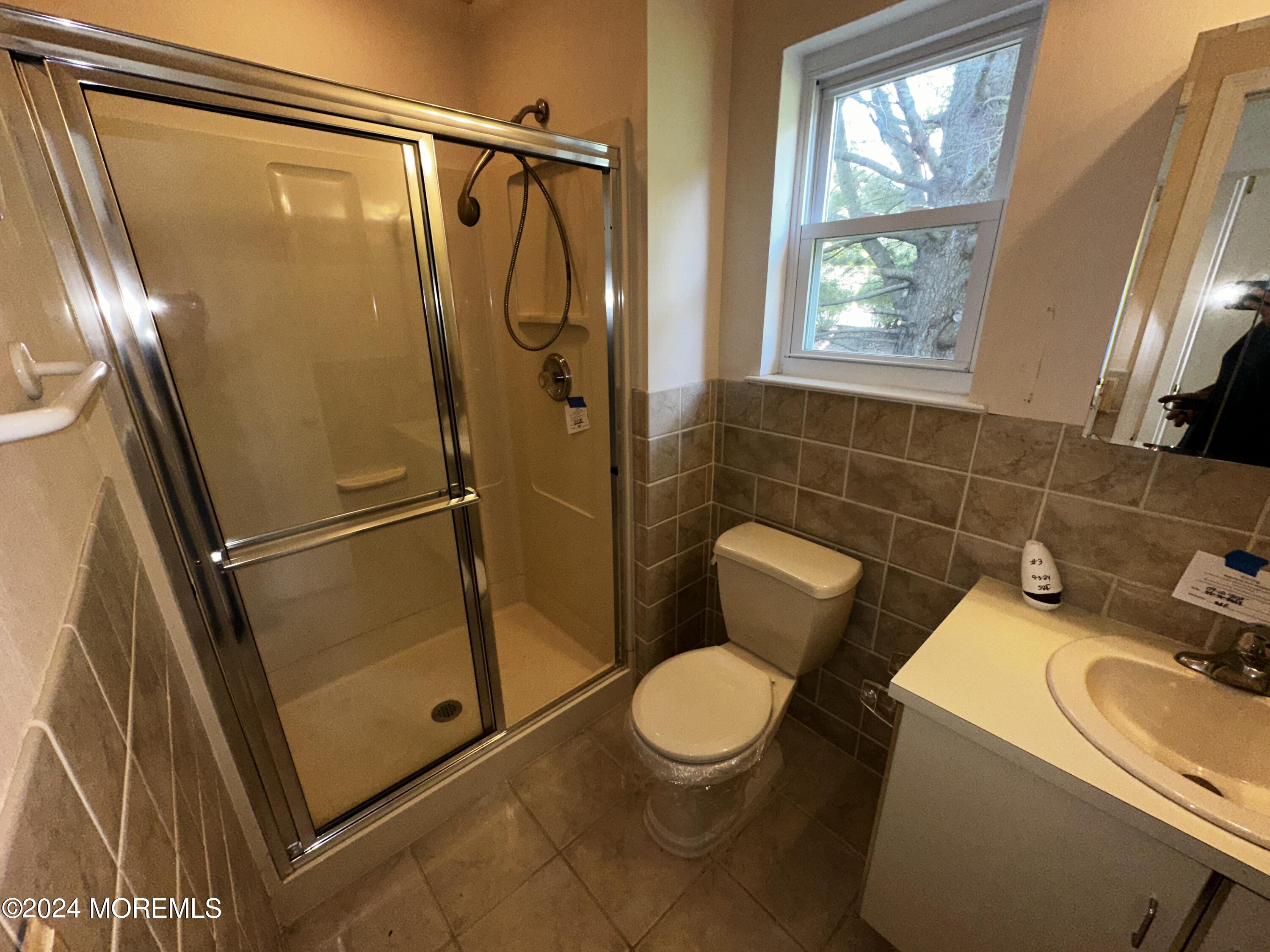 101 Almond Road Freehold, NJ 07728 - Photo 6 of 12 a bathroom with a sink toilet and shower