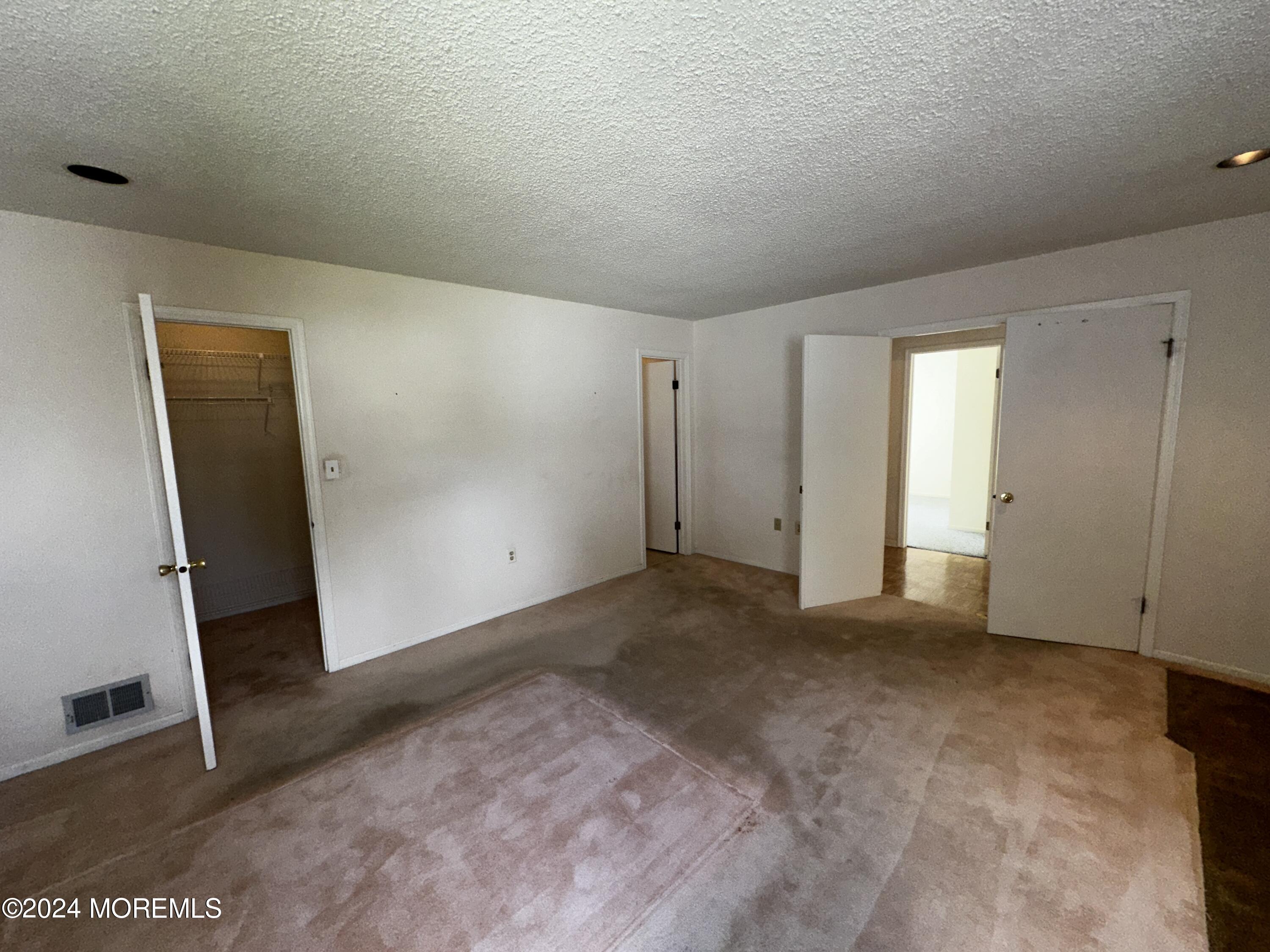 101 Almond Road Freehold, NJ 07728 - Photo 7 of 12 an empty room with windows