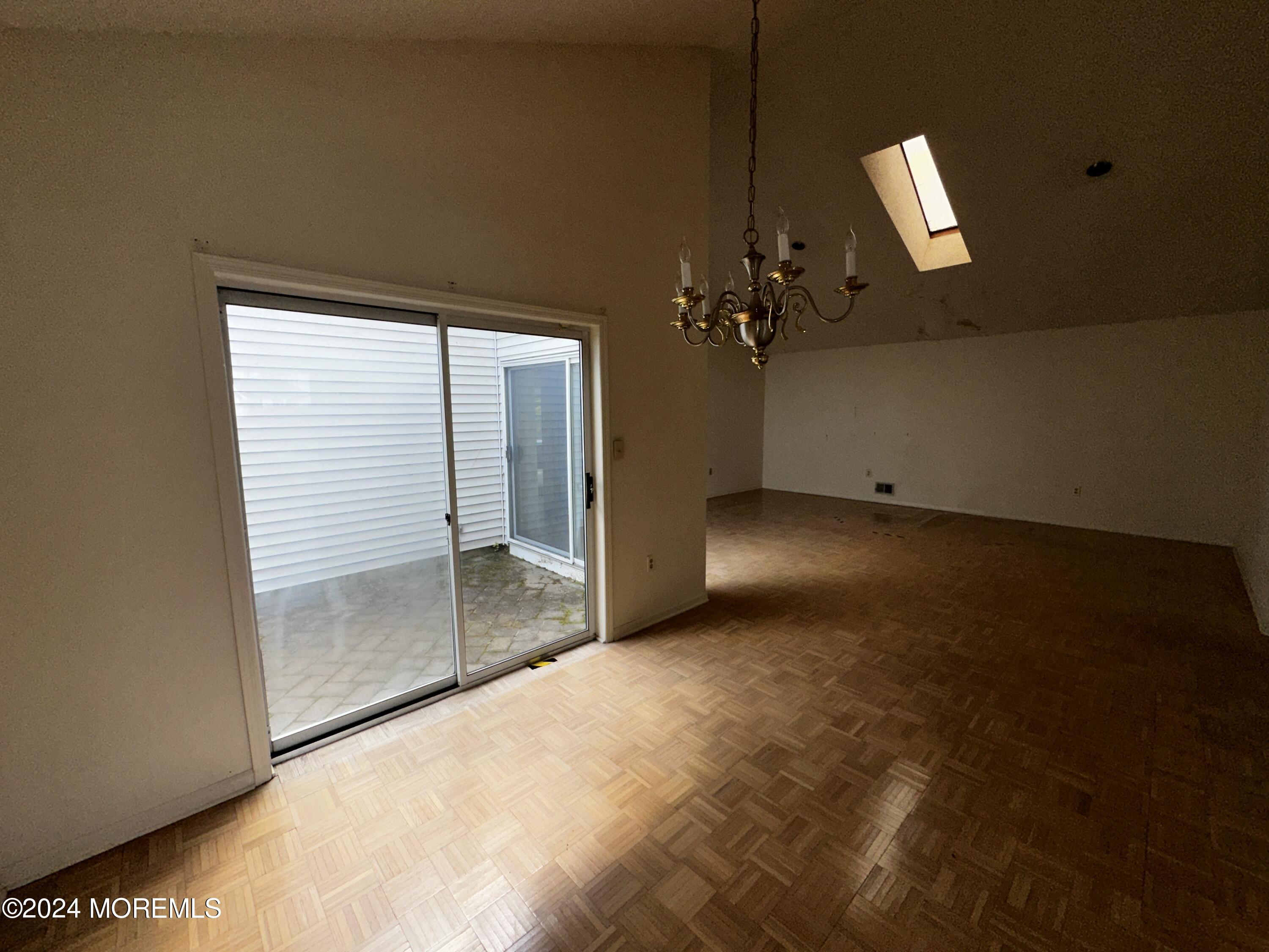101 Almond Road Freehold, NJ 07728 - Photo 10 of 12 wooden floor in an empty room with a window