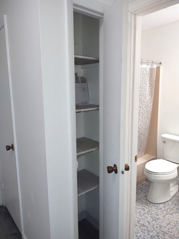 3 Leonard Road, Unit 3 Boxborough, MA 01719 - Photo 16 of 31 a bathroom with a toilet and a sink